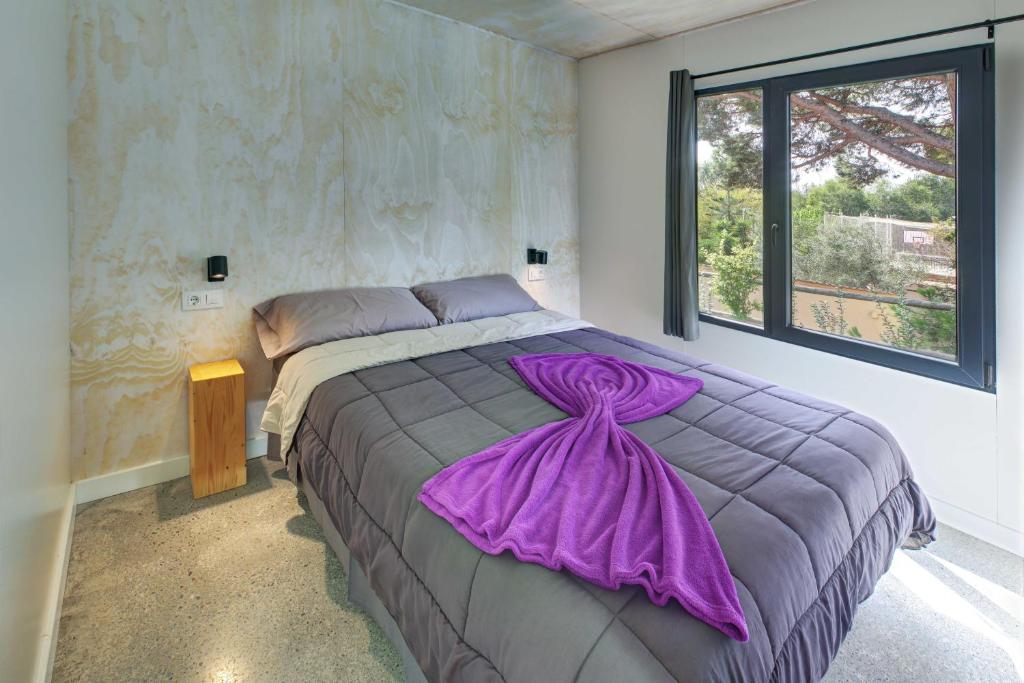 Cama o camas de una habitación en Camping Globo Barcelona