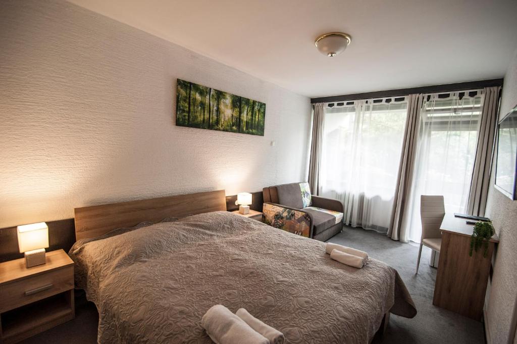 Postel nebo postele na pokoji v ubytování Hotel Faraon