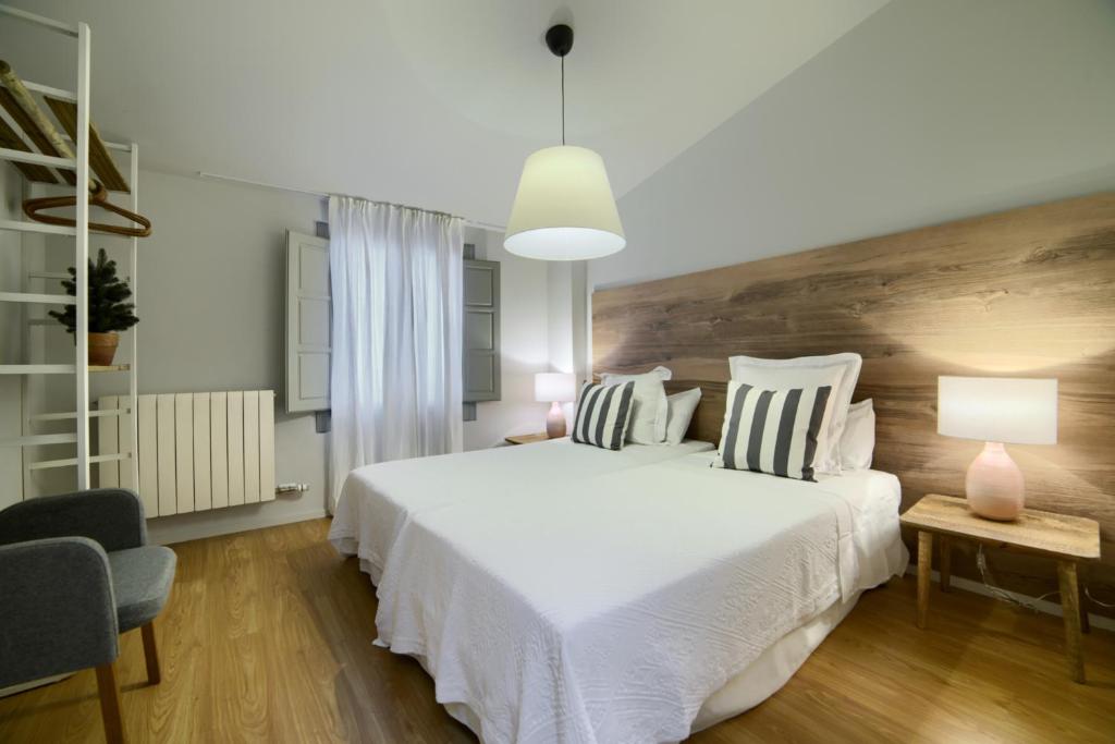 Postel nebo postele na pokoji v ubytování La Casa Gris