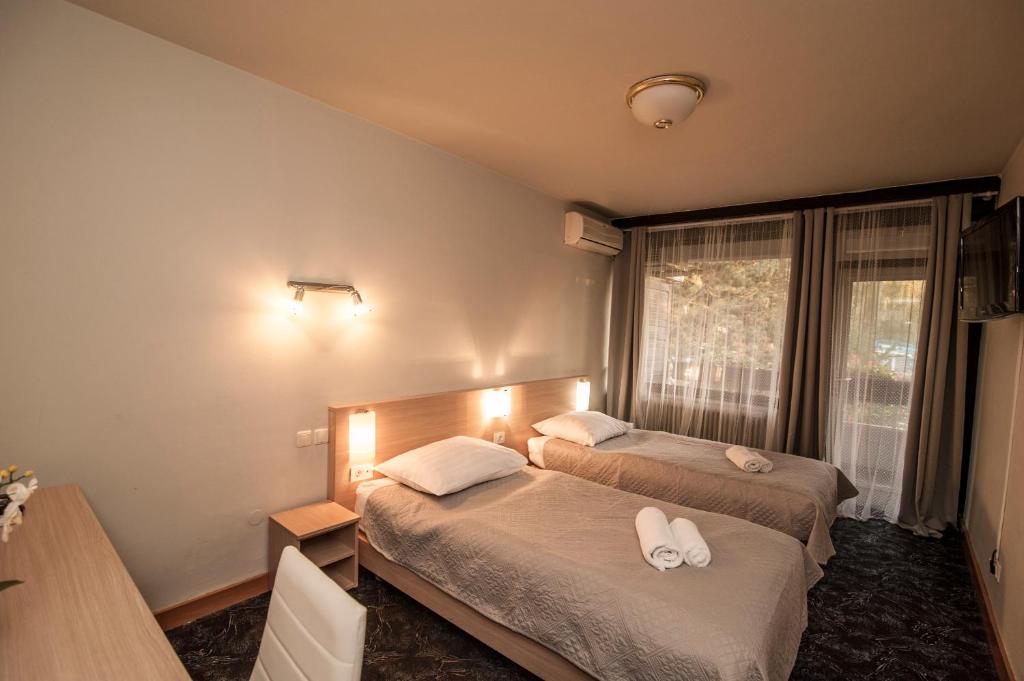 Postel nebo postele na pokoji v ubytování Hotel Faraon