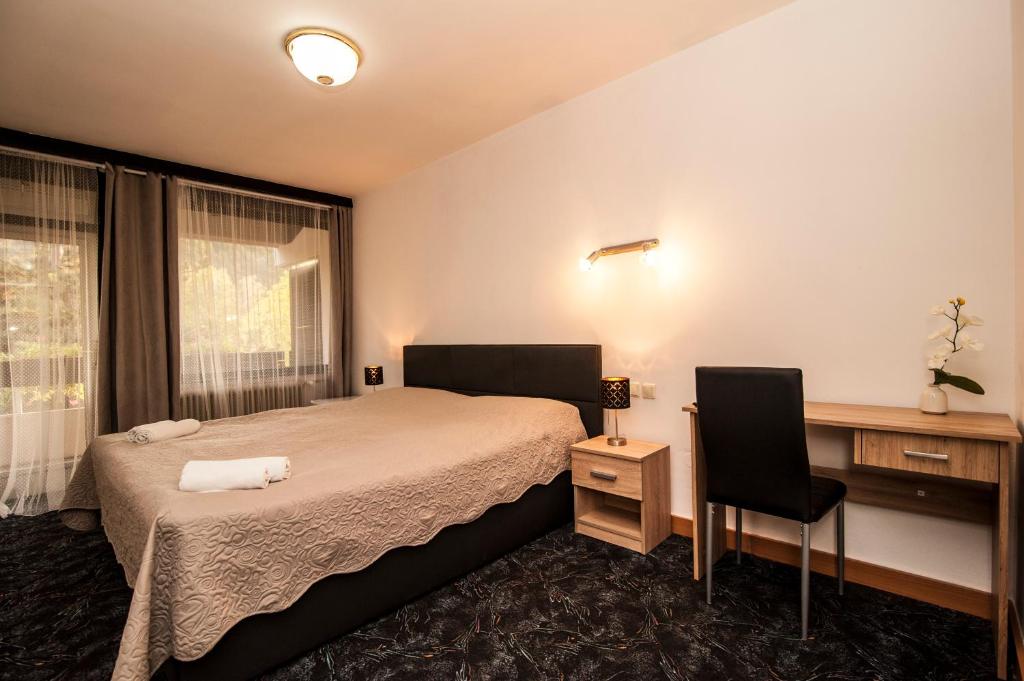 Postel nebo postele na pokoji v ubytování Hotel Faraon