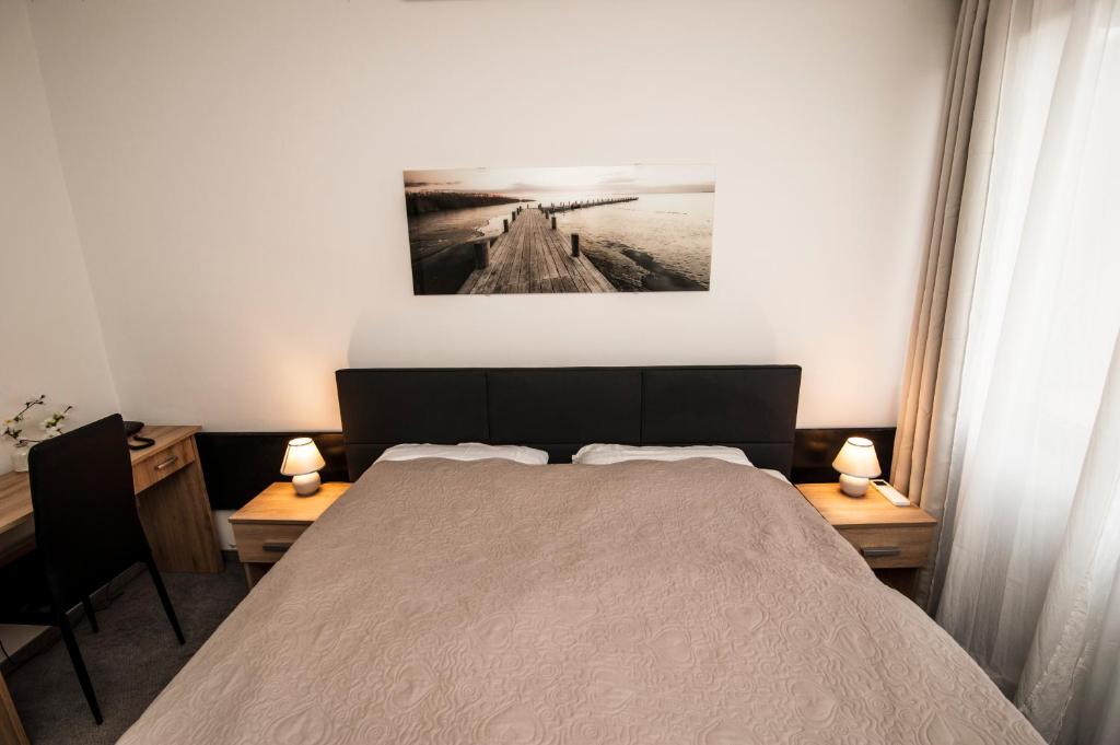 Postel nebo postele na pokoji v ubytování Hotel Faraon