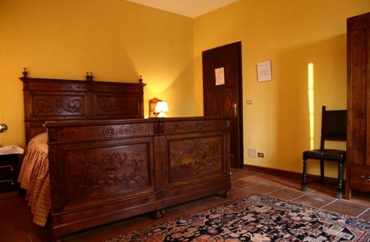 Postel nebo postele na pokoji v ubytování B&B il Baciass