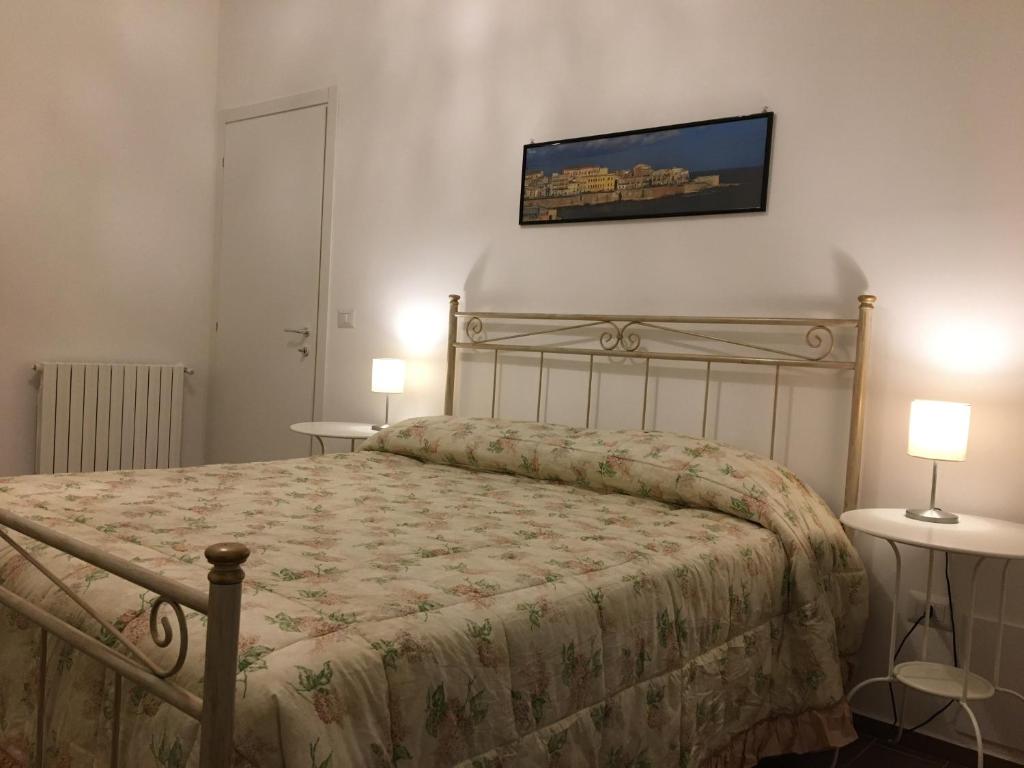 Łóżko lub łóżka w pokoju w obiekcie A Casa di Clara