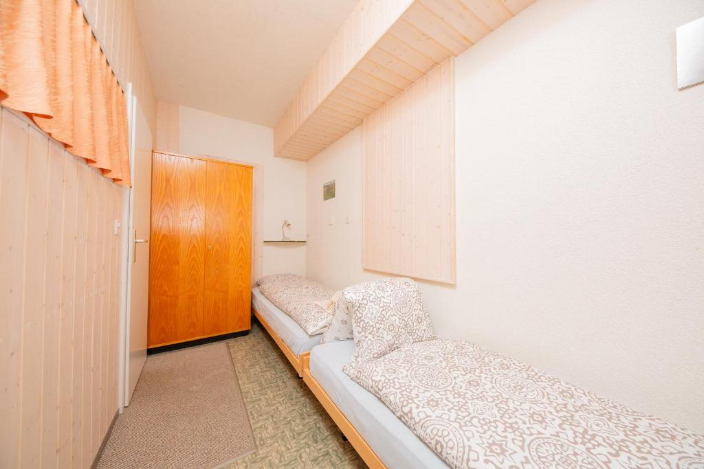 Postel nebo postele na pokoji v ubytování Haus Boccalino