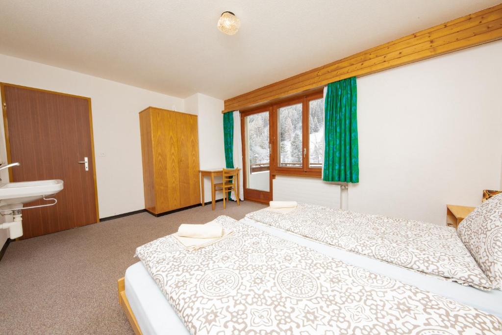 Postel nebo postele na pokoji v ubytování Haus Boccalino