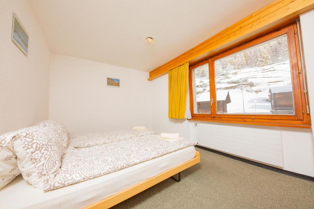 Postel nebo postele na pokoji v ubytování Haus Boccalino
