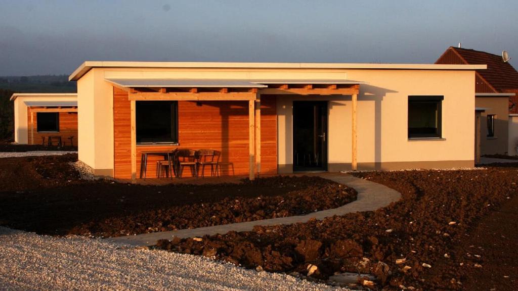 a small house with a porch and a patio at Hollweck´s Landoase in Pilsach