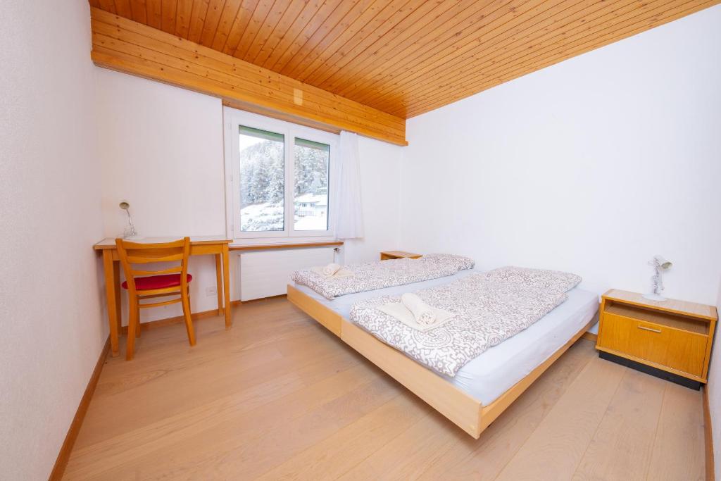 Postel nebo postele na pokoji v ubytování Haus Boccalino