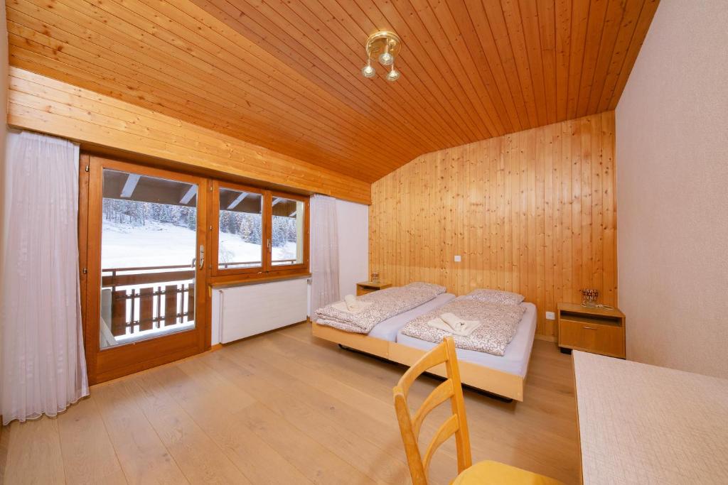 Postel nebo postele na pokoji v ubytování Haus Boccalino