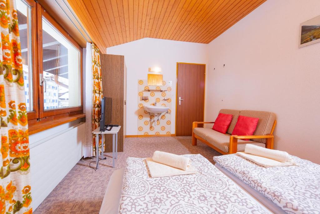 Postel nebo postele na pokoji v ubytování Haus Boccalino