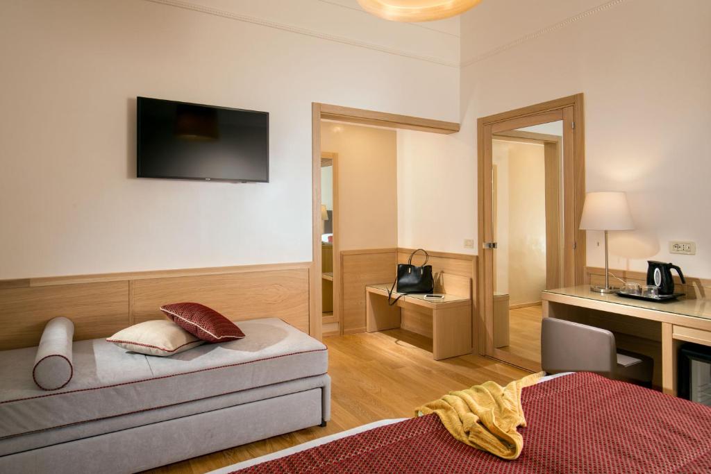 Postel nebo postele na pokoji v ubytování Hotel Nord Nuova Roma