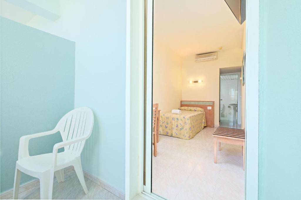 Postel nebo postele na pokoji v ubytování azuLine Hotel Pacific