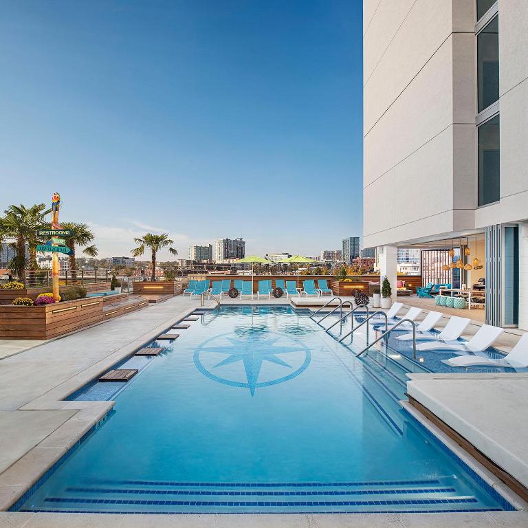a swimming pool on the roof of a building at Margaritaville Hotel Nashville in Nashville