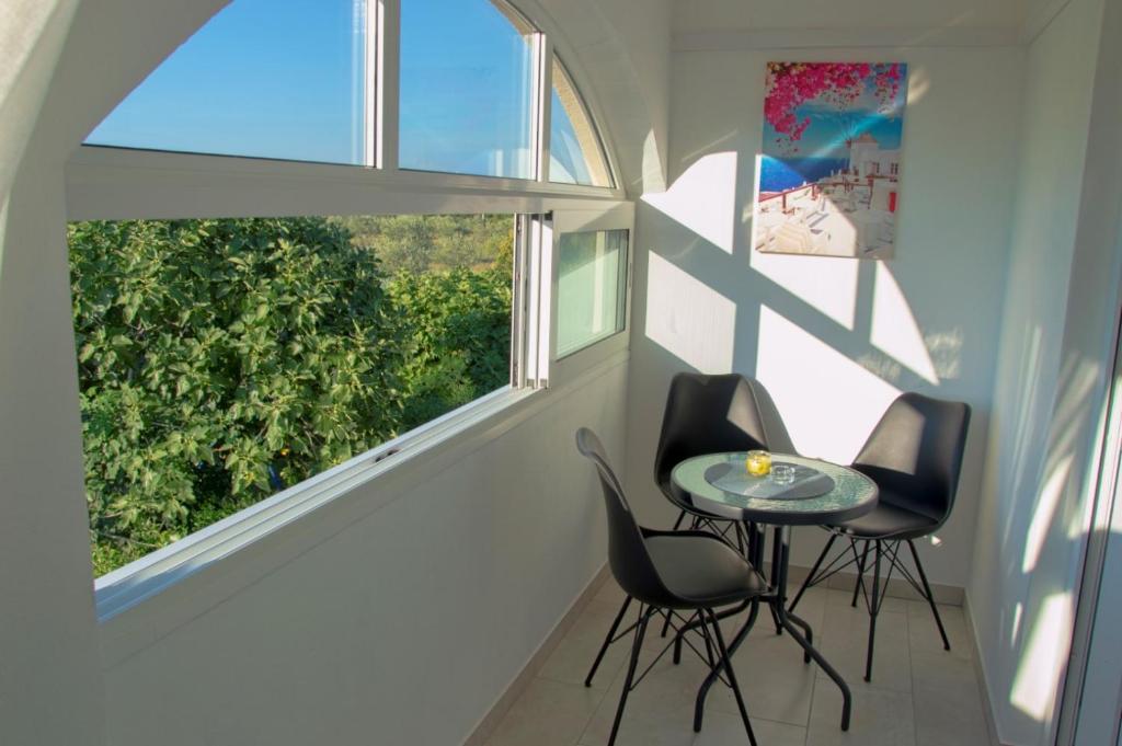 a room with two chairs and a table and a window at Studio Apartment Zen in Murine