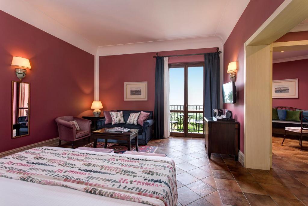 Postel nebo postele na pokoji v ubytování Hotel Baglio Oneto dei Principi di San Lorenzo - Luxury Wine Resort