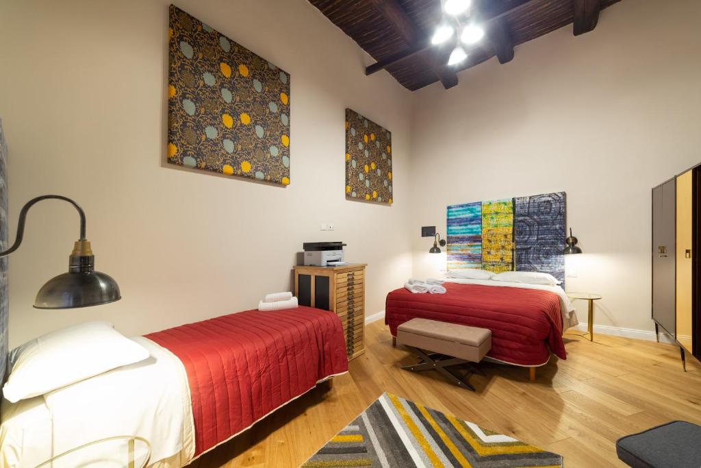 Letto o letti in una camera di Design Apartment Next Sorbillo on Tribunali St By HouseinNaples