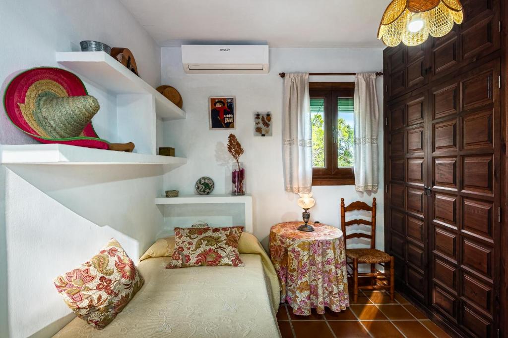 Postel nebo postele na pokoji v ubytování Villa Cortijo del Peñón
