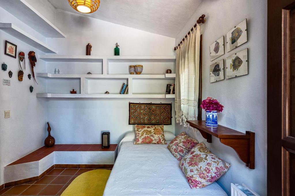 Postel nebo postele na pokoji v ubytování Villa Cortijo del Peñón