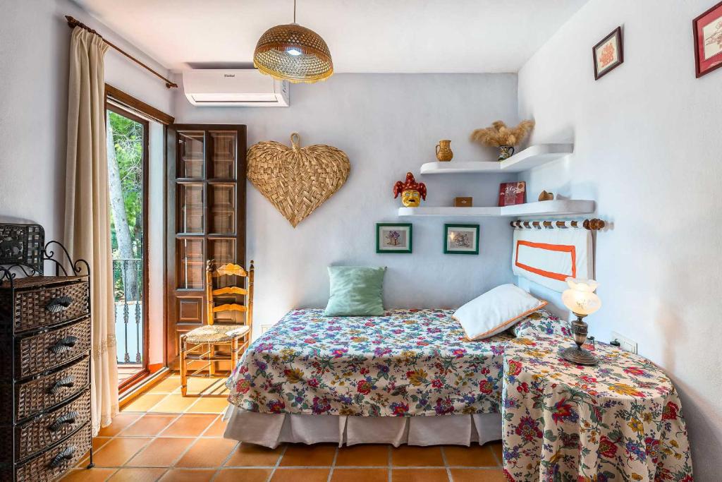 Postel nebo postele na pokoji v ubytování Villa Cortijo del Peñón