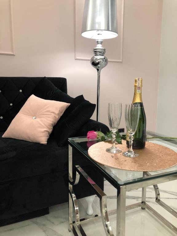 Nápoje v ubytovaní Apartament Luksusowy z sauną