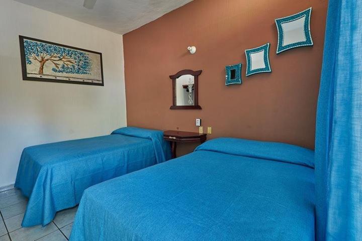 Postel nebo postele na pokoji v ubytování Hotel Posada San Rafael