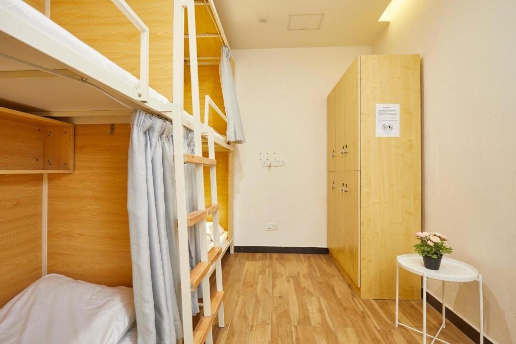 Postel nebo postele na pokoji v ubytování Shanghai Meego Qingwen Hotel
