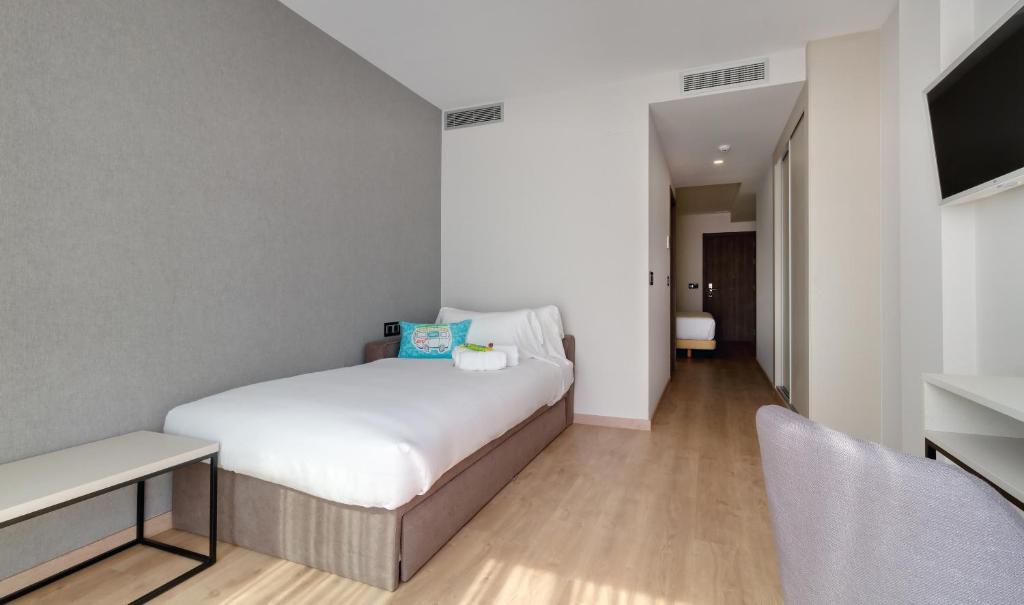Cama o camas de una habitación en Oca Playa de Foz Hotel & Spa