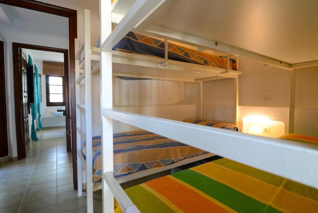 a bunk bed in a room with a hallway at PIVERD DEL GOLF 13 in Pals