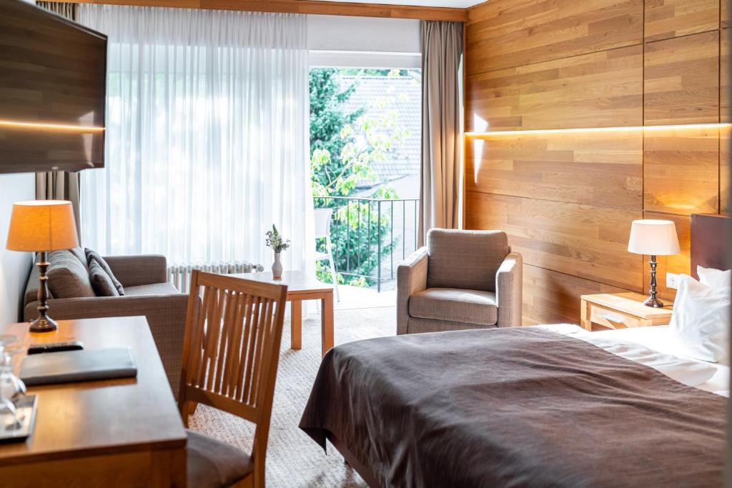 Postel nebo postele na pokoji v ubytování Waldhotel Tannenhäuschen