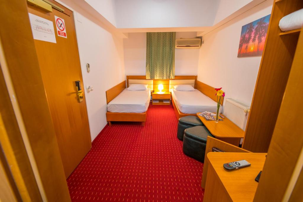 Postel nebo postele na pokoji v ubytování Hotel Sir Orhideea