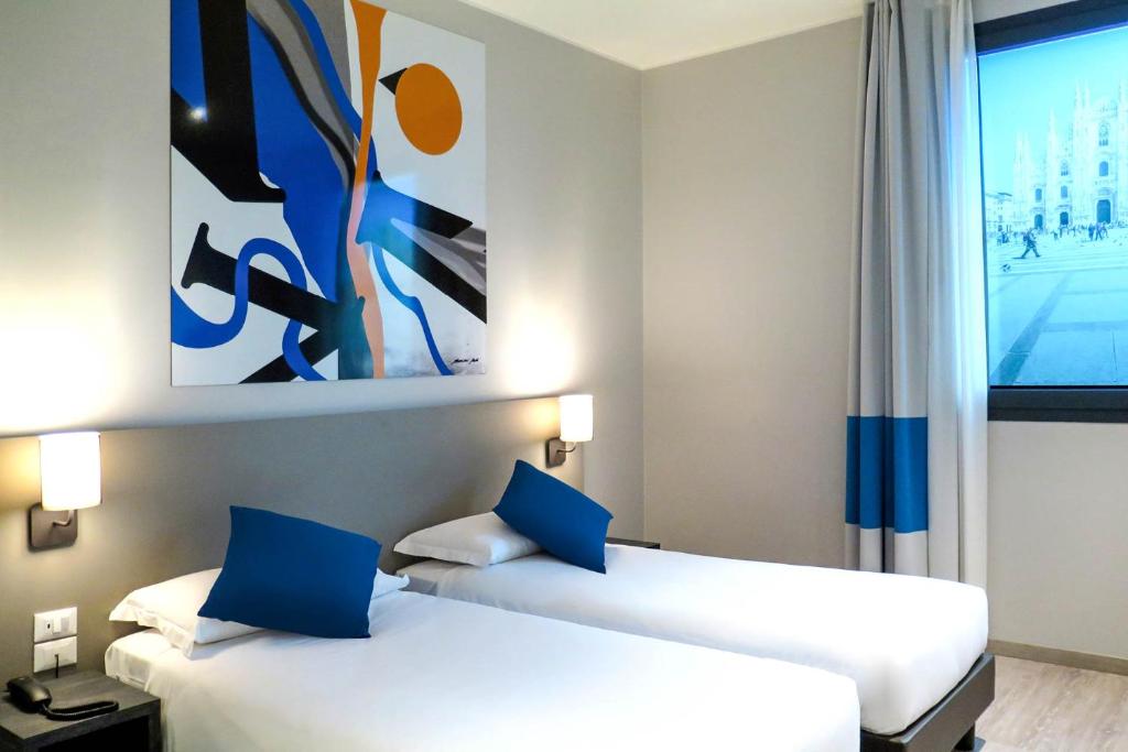Postel nebo postele na pokoji v ubytování AN Hotel Dépendance Milano Melegnano