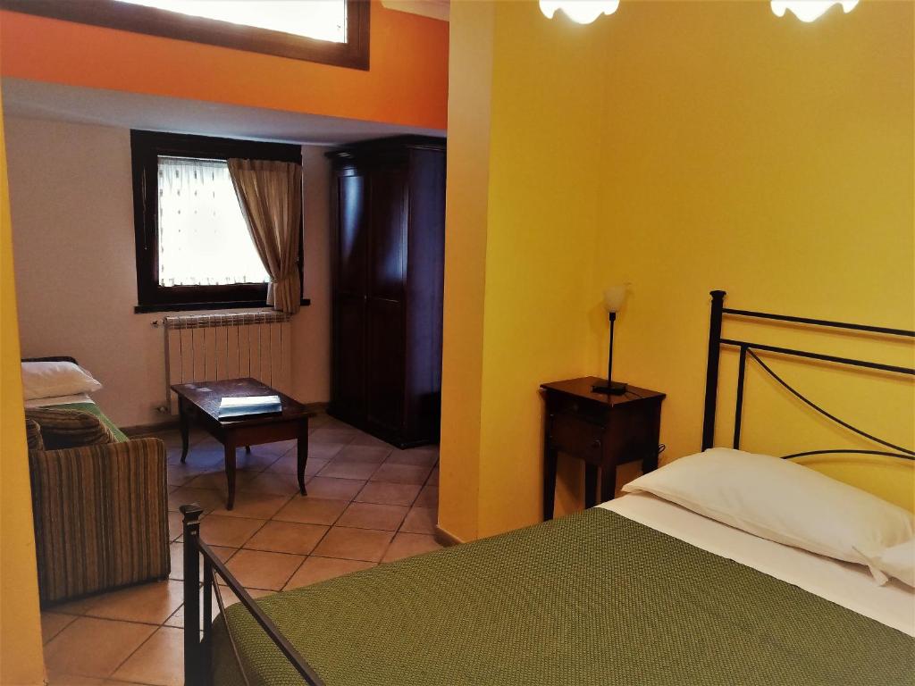 Postel nebo postele na pokoji v ubytování Hotel Pace
