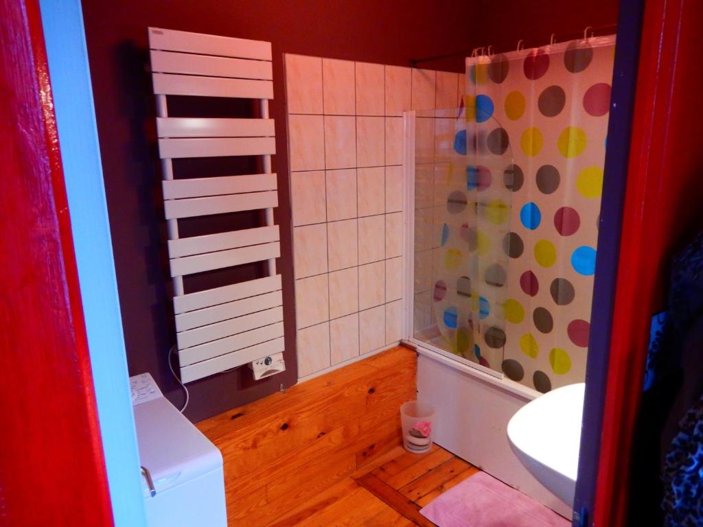 a bathroom with a toilet and a sink and a shower at Les Petits Galets appartement DUPLEX in Fécamp