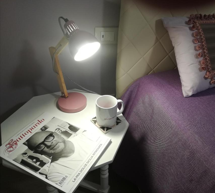 Łóżko lub łóżka w pokoju w obiekcie Persiane al Cassaro