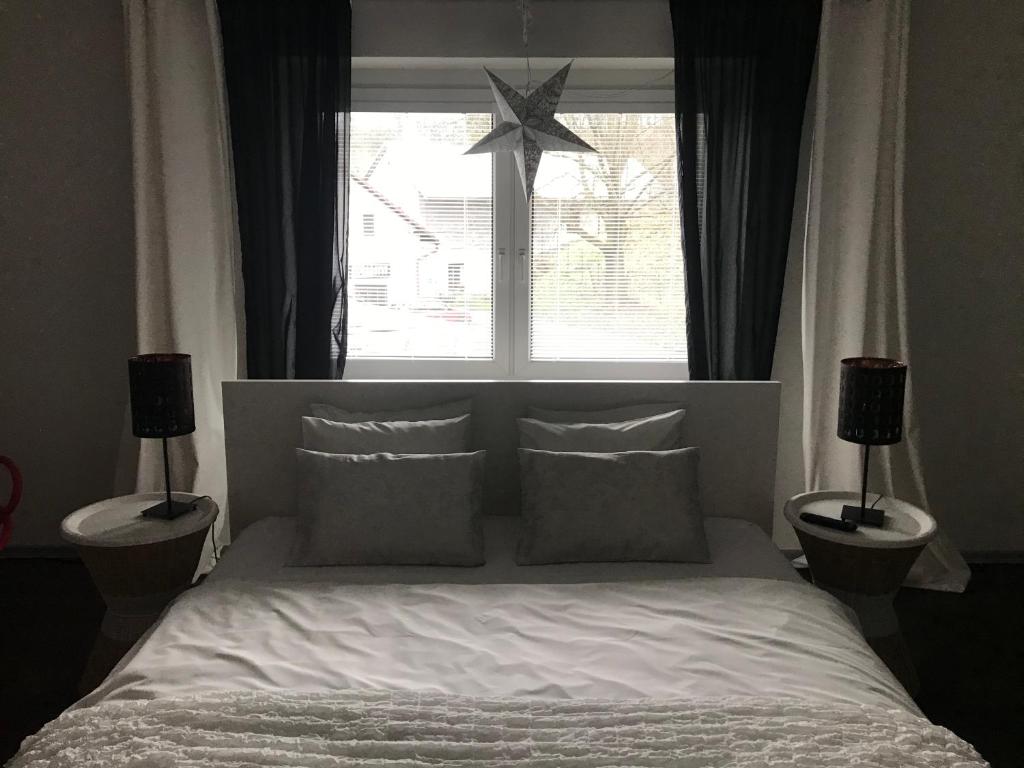 Postel nebo postele na pokoji v ubytování Apartments Centrum