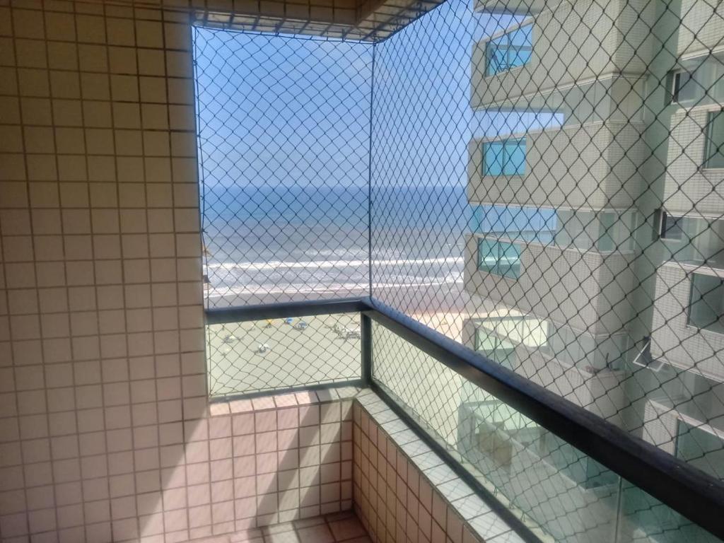 a view of a bathroom from a window in a building at Alto Padrão com 94 mtrs - Frente Mar - sacada com Vista Mar in Praia Grande