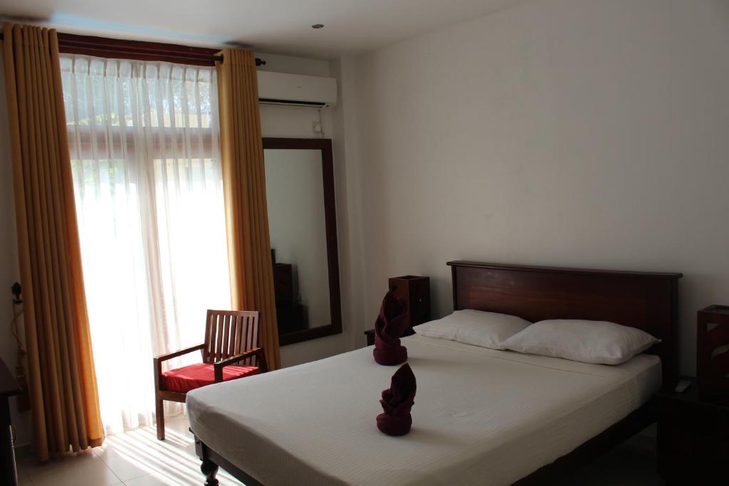 Postel nebo postele na pokoji v ubytování Villa Kapuru
