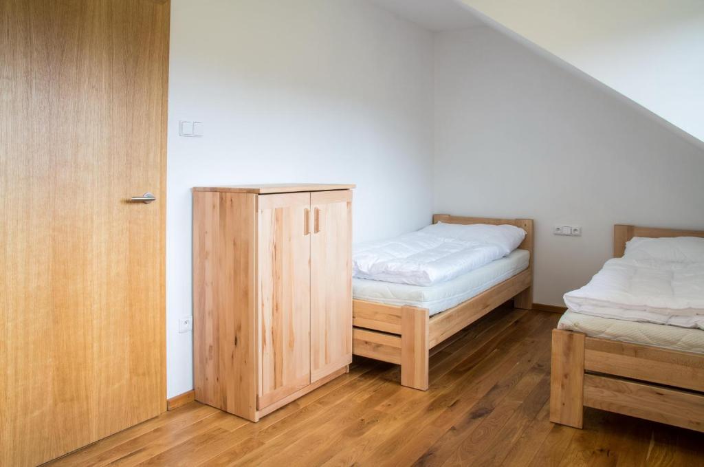 Postel nebo postele na pokoji v ubytování Hájenka Zátoky