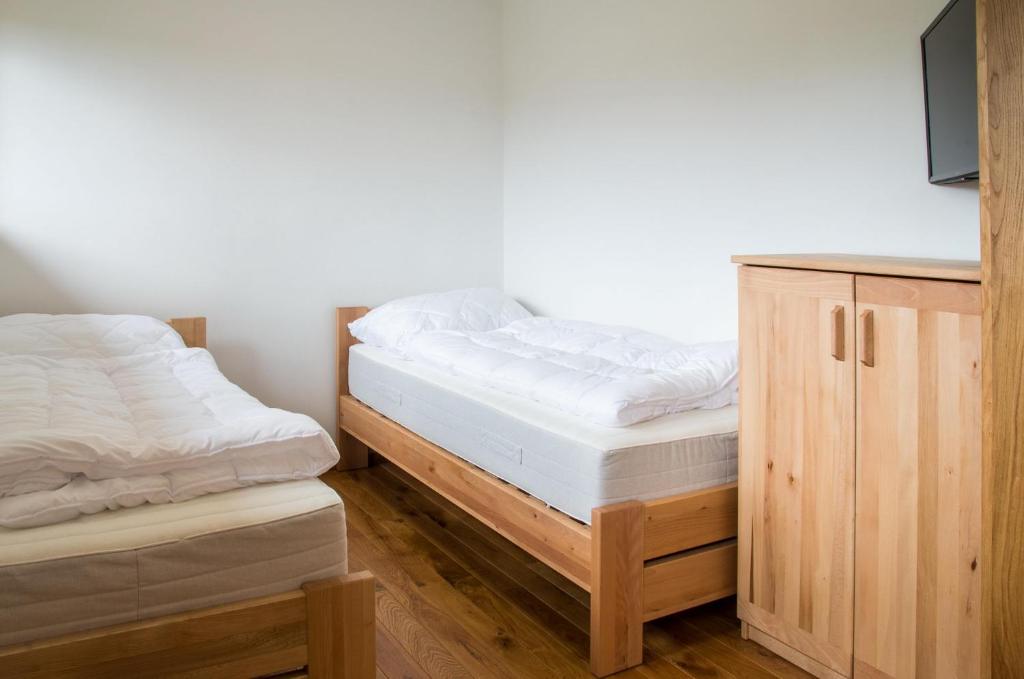 Postel nebo postele na pokoji v ubytování Hájenka Zátoky