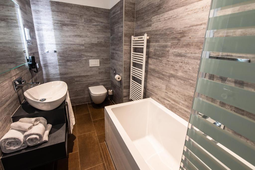 Koupelna v ubytování premium by GS Hotel
