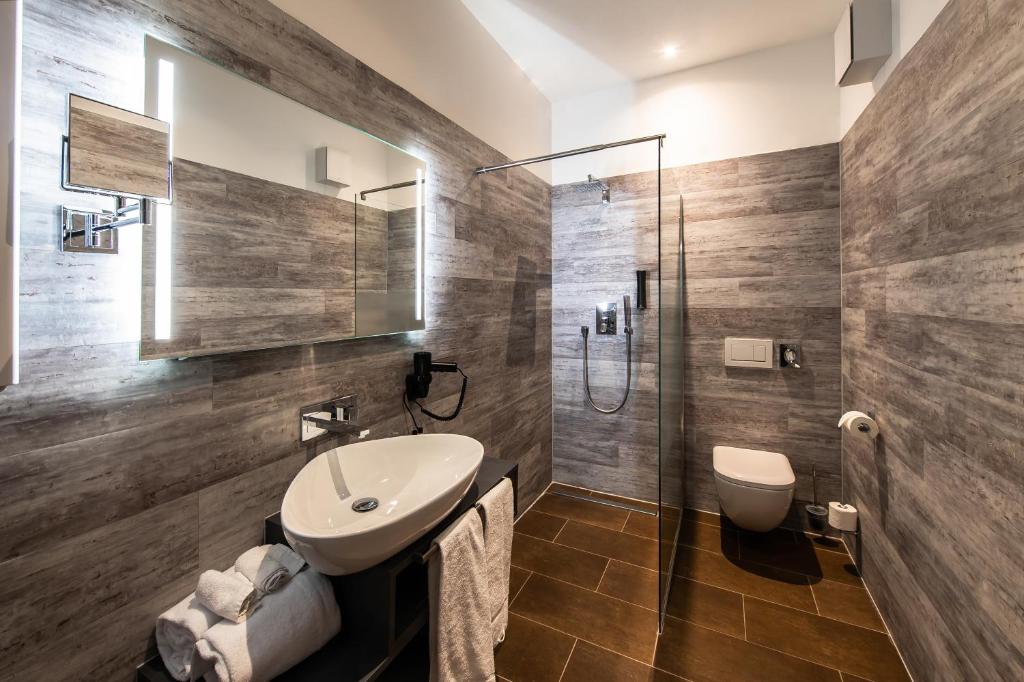Koupelna v ubytování premium by GS Hotel