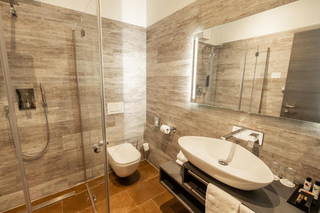 Koupelna v ubytování premium by GS Hotel