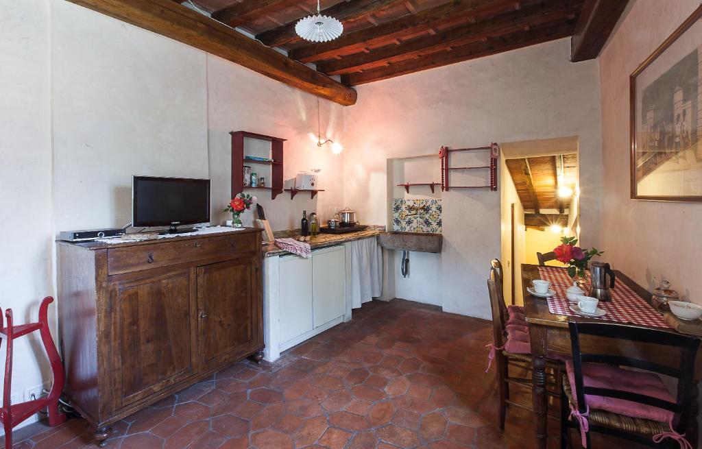 a kitchen with a counter and a table in a room at Villa Il Paradisino in Sesto Fiorentino