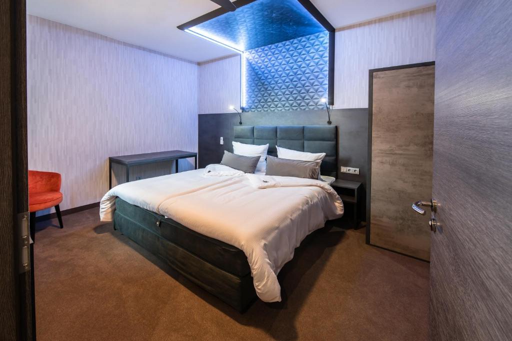 Postel nebo postele na pokoji v ubytování premium by GS Hotel