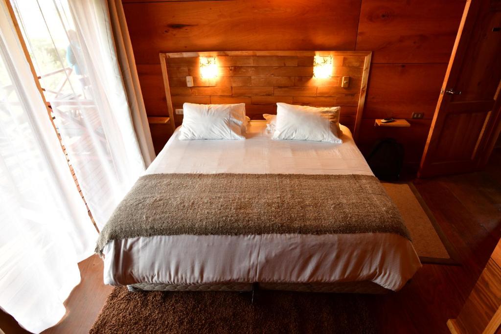 Postel nebo postele na pokoji v ubytování Hostal Boutique Los Arrayanes