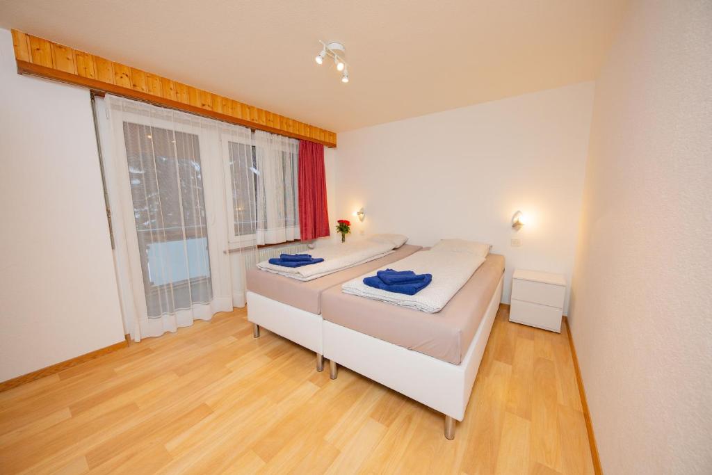 Postel nebo postele na pokoji v ubytování Haus City