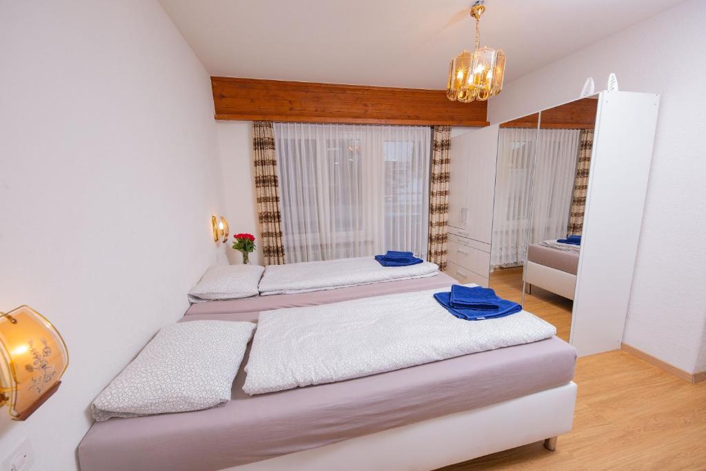 Postel nebo postele na pokoji v ubytování Haus City