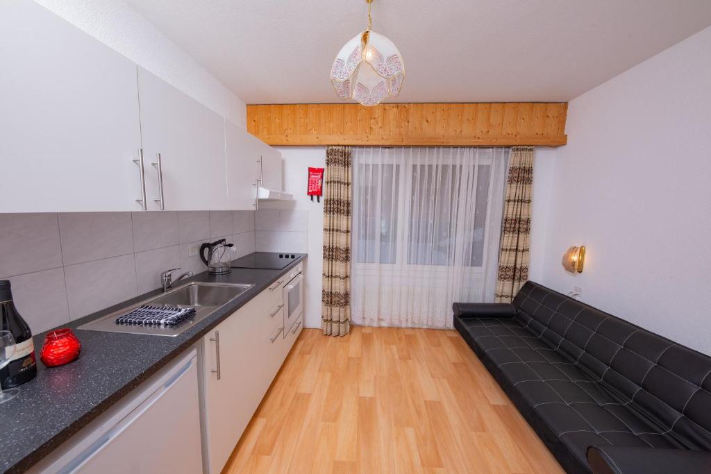 Kuchyň nebo kuchyňský kout v ubytování Haus City