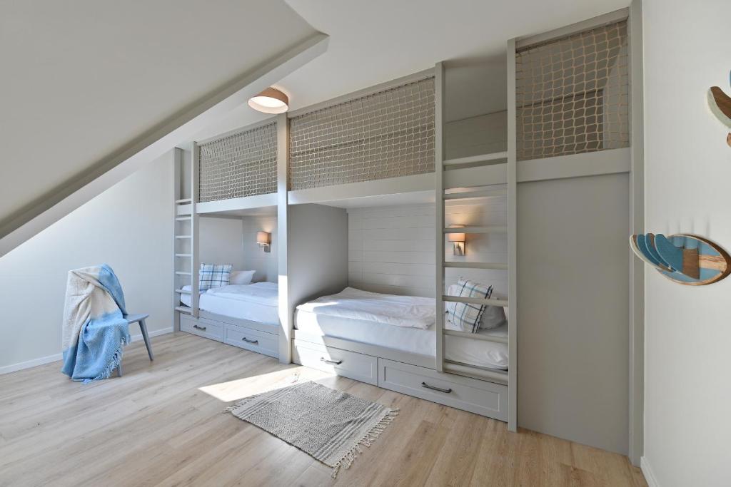 Postel nebo postele na pokoji v ubytování Hotel- & Ferienanlage Kapitäns-Häuser Breege